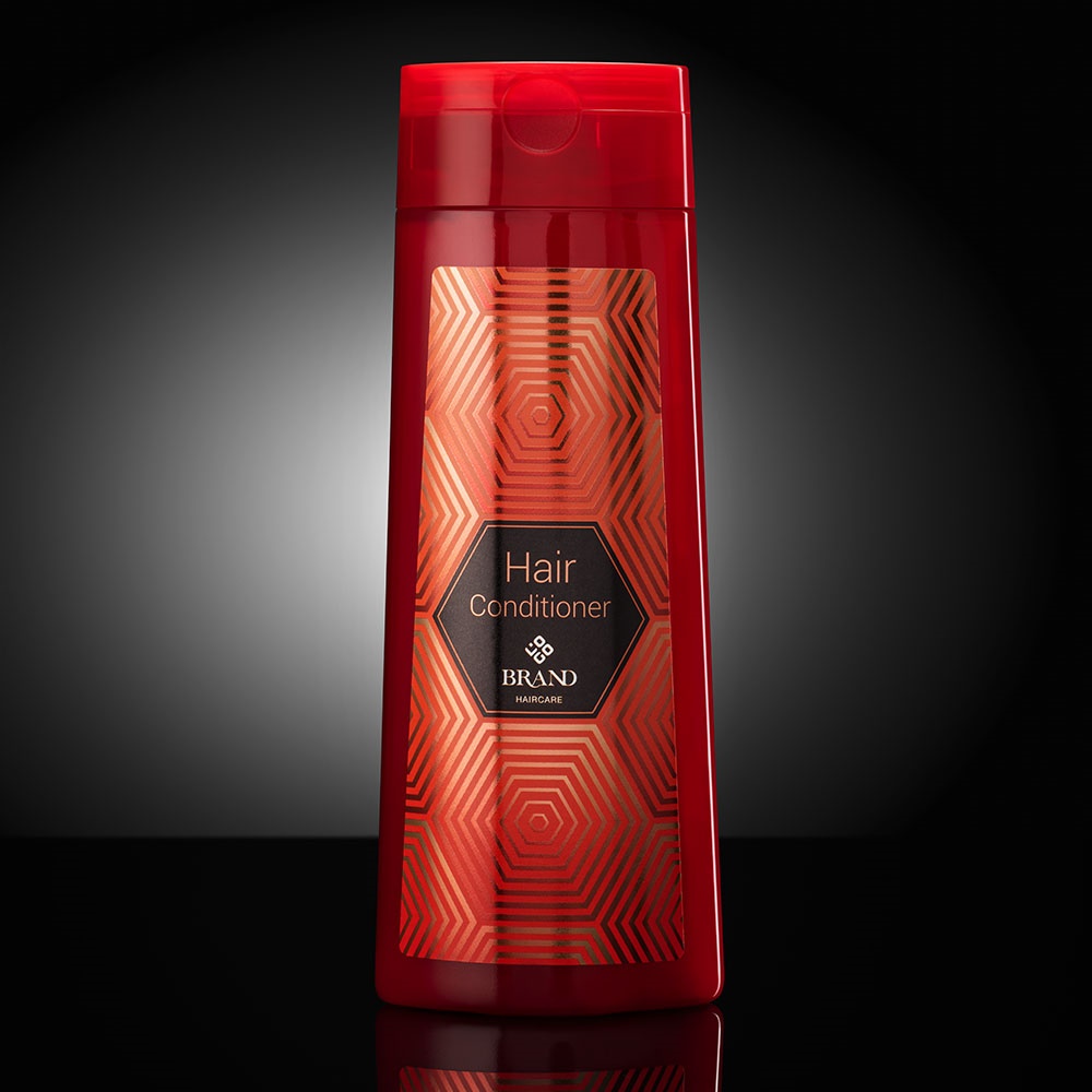 Shampoo bottle using cold transfer labels with Alufin embellishment